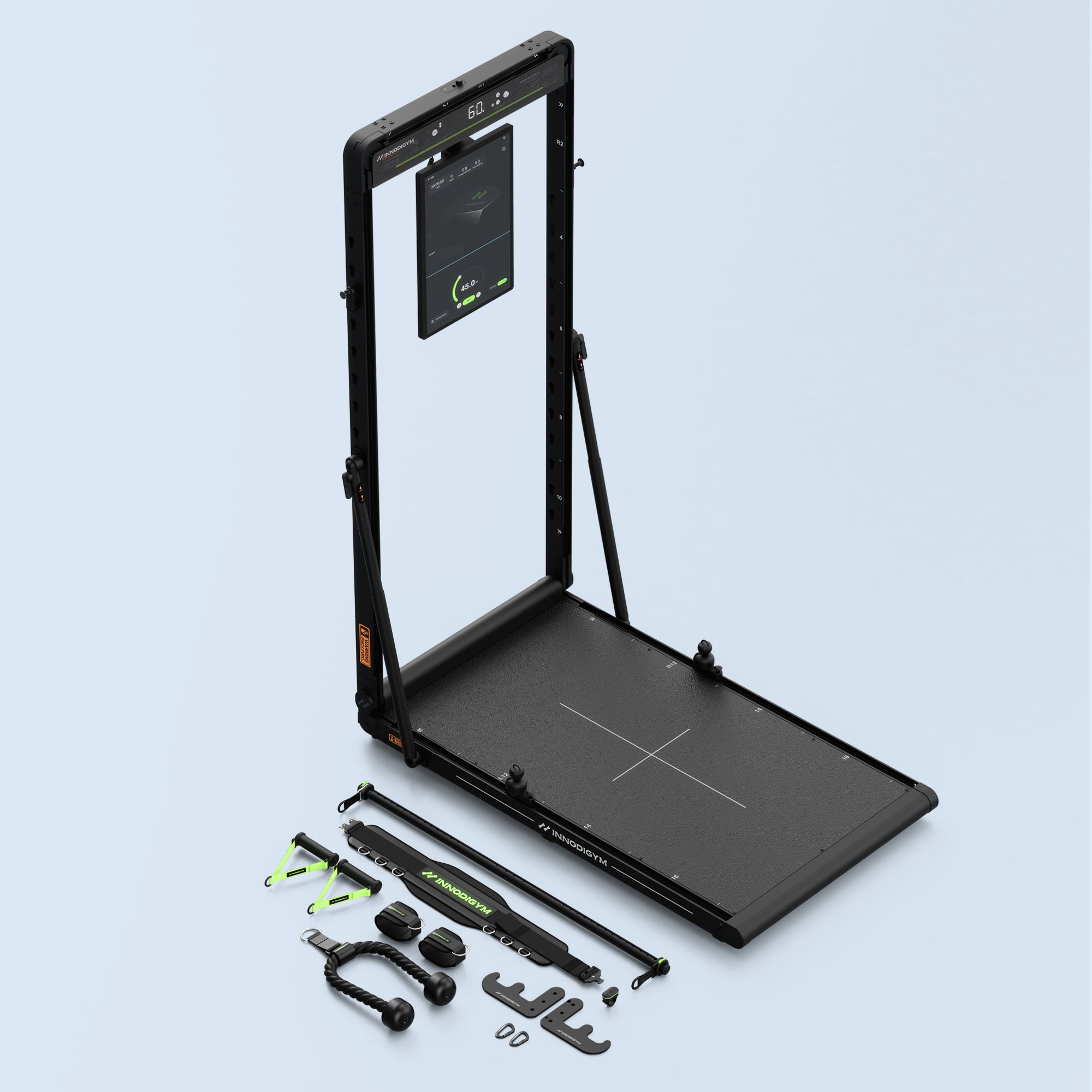 The INNODIGYM OMNI X1 Pro fully set up with its full accessory kit laid out in front of it — handles, ankle straps, a lat bar, and a resistance bar