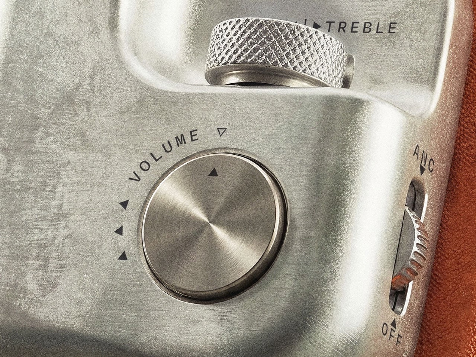TUNE X3 concept headphones, close-up of the knurled volume dial, bass/treble switch and ANC toggle